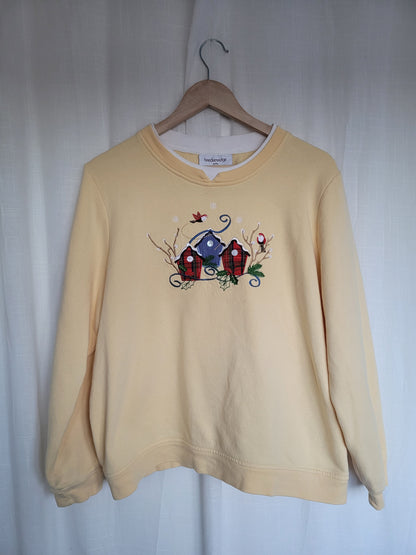 ✨ The Winter Birdhouses of Evergreen Village - vintage christmas butteryellow crewneck sweater - size L/XL