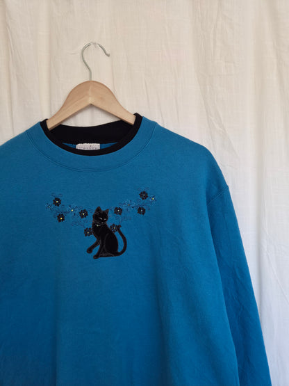 🐈‍⬛ Nine Lives & Wildflowers - vintage blue crewneck sweater with embroidered black cat (Perfectly Imperfect) - size L
